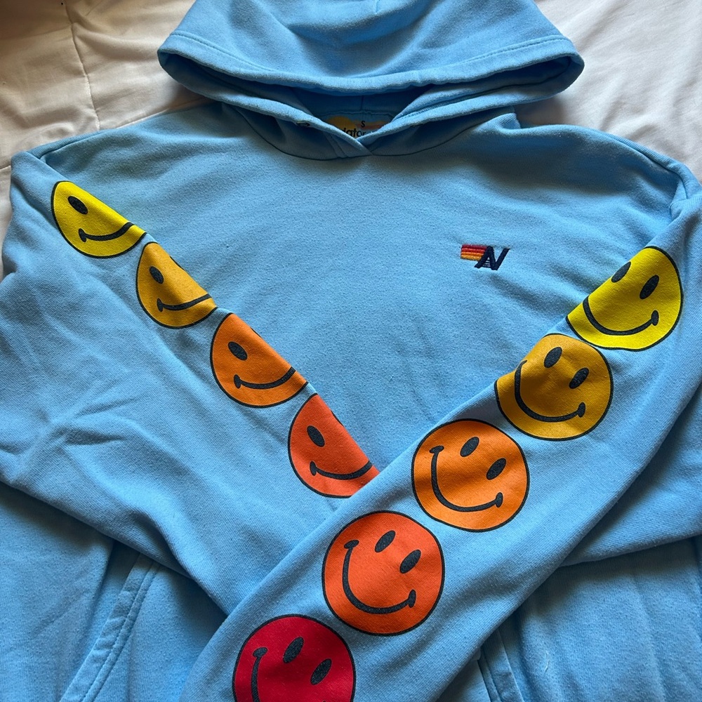 AN Aviator Nation Light Blue Hooded Sweatshirt with Smiley Sleeve Design - Brand